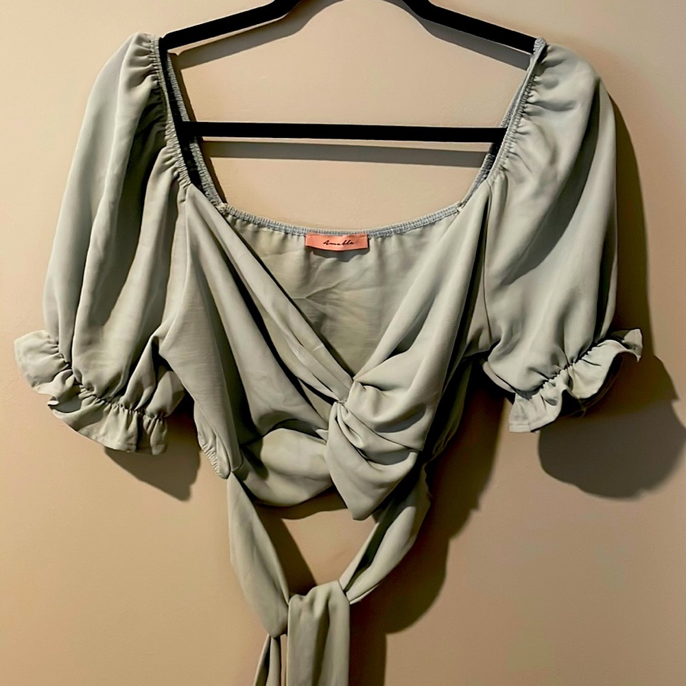 Very light blue wrap around crop top size large. Never been used